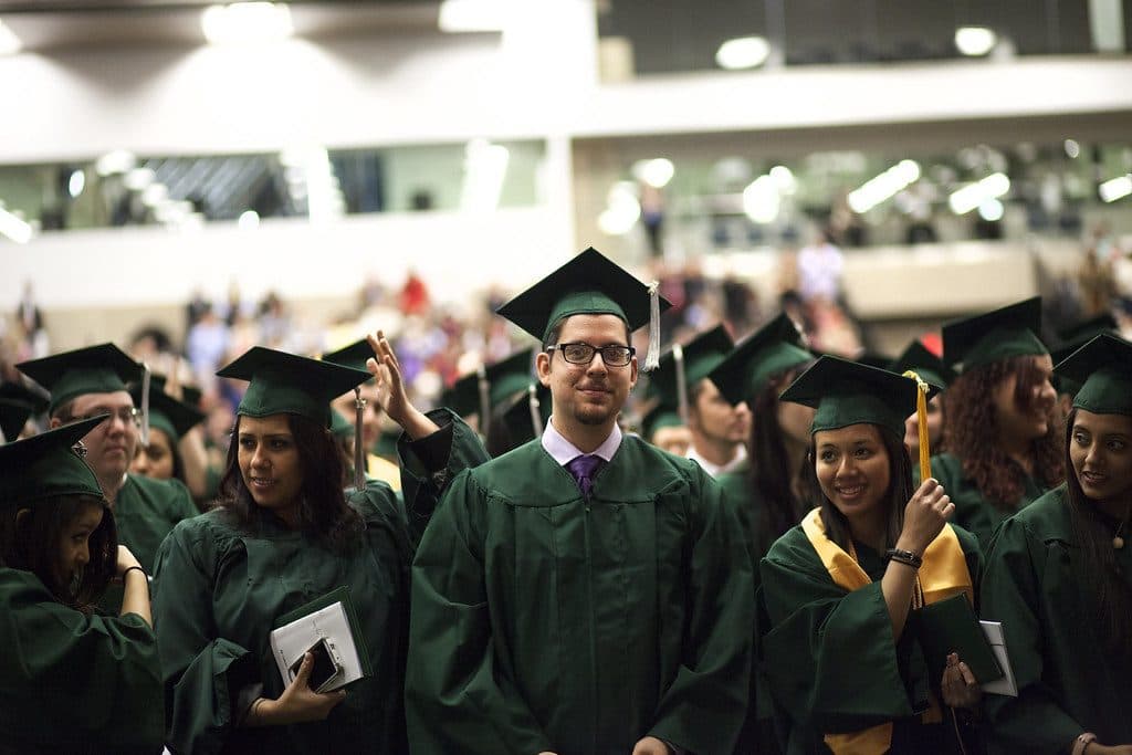 Graduating students in caps and gowns at a commencement ceremony
